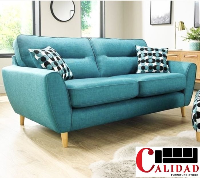 Shop the Atticus Fabric Sofa in Kenya—turquoise elegance, plush comfort, and a hardwood frame make it a stylish and cozy choice for any living room.